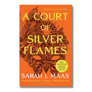 Book cover of 'A Court of Silver Flames' by Sarah J. Maas, featuring a vibrant orange background with a dark brown ornate mask illustration and bold yellow title text.
