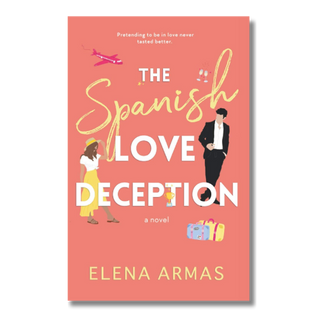 Book cover for 'The Spanish Love Deception' by Elena Armas, featuring a coral pink background with stylized illustrations of a woman in a yellow dress, a man in a black suit, a pink airplane, and colorful suitcases.